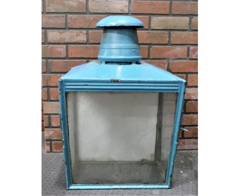 A Victorian street light lantern, painted steel construction with hinged side doors.  Glazed panels.  70cm tall, 43w. 