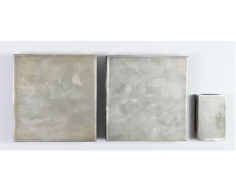 A silver set of two cigarette packet cases and matching match box case, by Sampson Mordan, Birmingham 1938, with engine turne