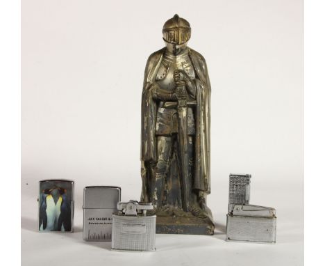 A 1950's figural petrol table cigarette lighter, in the form of a knight, hinged helmet to reveal lighter mechanism, together