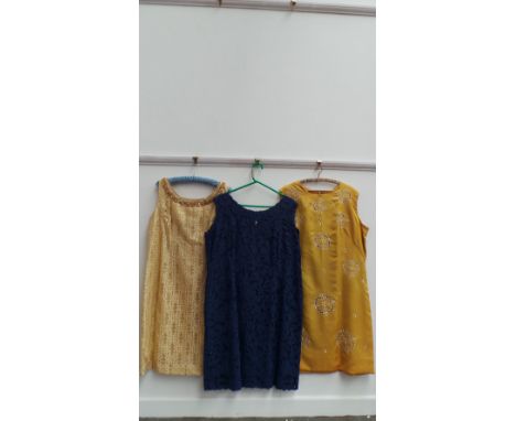 3 Vintage dresses, one blue floral cut-work day shift seize 18/20, a gold linen shift with white embroidered flowers seize 18