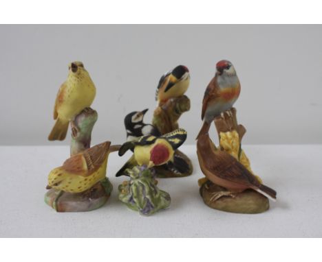 Four Royal Worcester twin bird studies, one a pair of yellowhammers, a pair of linnets, a pair of Pied Woodpeckers and a West