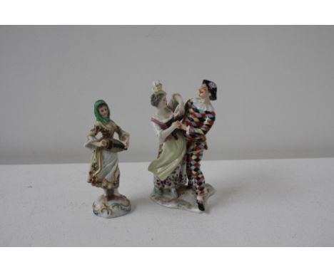 A Chelsea Pottery style figurine playing a lute (damage) with a green head scarf, red anchor mark to base, 15cmH with a Dresd