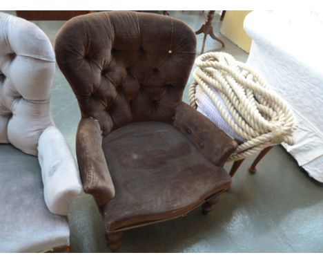 A 20th century Victorian style button back tub chair in brown material and turned legs