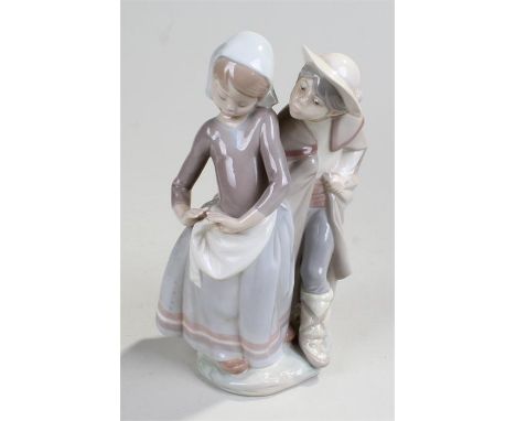 Lladro porcelain figure, of a boy and a girl