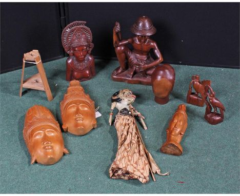 Collection of Balinese cared objects, to include masks and figures, also together with a puppet, (qty) 