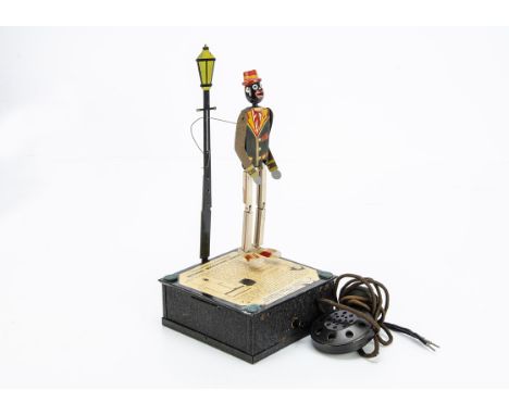 1930s National Microphone Dancer Toy, comprising black wooden dancing figure with articulated arms, legs and mouth, attached 