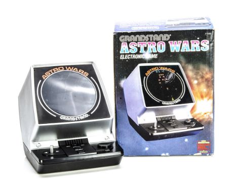 A Grandstand Astro Wars Electronic Game, in original box with instructions, leaflet and warranty card, VG-E, tested and worki