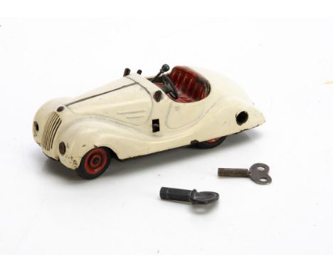 Schuco Examico 4001 Clockwork Car, in white, tested well, two non original keys, F-G, lacks windscreen, paint loss to edges a