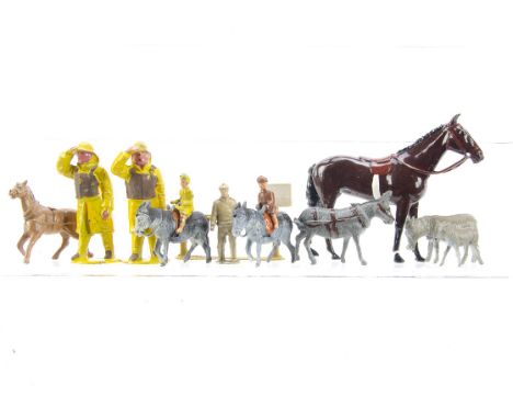 F G Taylor Donkey Ride pieces comprising donkeys (2), child riders (2), colt, standing donkey, man and hitching rail, Britain