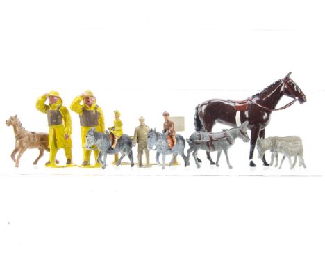 F G Taylor Donkey Ride pieces comprising donkeys (2), child riders (2), colt, standing donkey, man and hitching rail, Britain