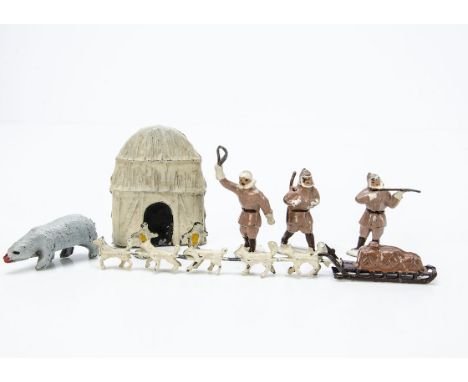 Timpo Alpine series comprising Igloo with eskimo hunters (3) and sled with dog team, penguins (2) and polar bear, generally G