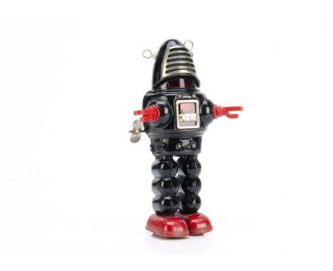 A Yoshiya (K.O) Japan Tinplate Clockwork Planet Robot, Robby the Robot type, black tin body, red plastic hands, red tinplate 