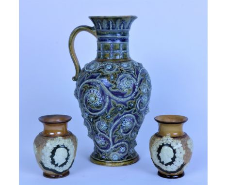 A good quality Doulton Lambeth Vase, 19th Century, with embossed floral decoration, 28cms (11") high, and an attractive small