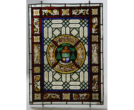 A very attractive leaded and stained glass Panel, with multi glass plates and a centre roundel painted with a crest, 37" x 27