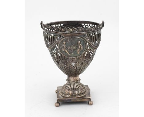 An attractive 18th Century English pierced silver Urn, decorated in the Adams taste, with  repoussé medallions, on square pli