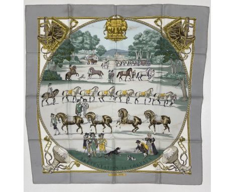 An attractive silk "Hermes" Scarf, "Presentation de Chevaux" with medallion centre depicting figures and horses and motifs in