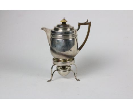 A plain body silver Tea Kettle, with wooden handle, and carved knob, London c. 1813, by Solomon Hougham, on a tripod stand wi