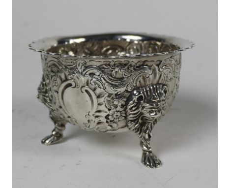 An Irish silver circular Sugar Bowl, Dublin 1894, retailed by West &amp; Sons, with wavy serrated rim, the deep body embossed