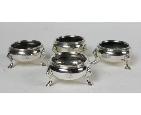 A good set of 4, early George III Irish silver Salts, Dublin c. 1760, plain circular form on three hoof feet, approx. 12 ozs.