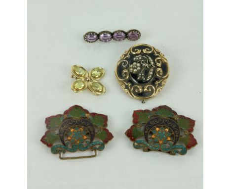 An attractive Stick Brooch, inset with four large amethyst stones; a floral shaped Brooch with citrine stone insets; an unusu