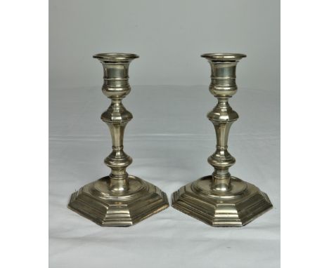 A pair of small silver Candlesticks, in the George II style, London 1910, each 7" (18cms) with weighted base. (2)
