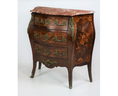 A very attractive bombé shaped French rosewood and marquetry Commode, with rouge and white speckled marble top above three dr