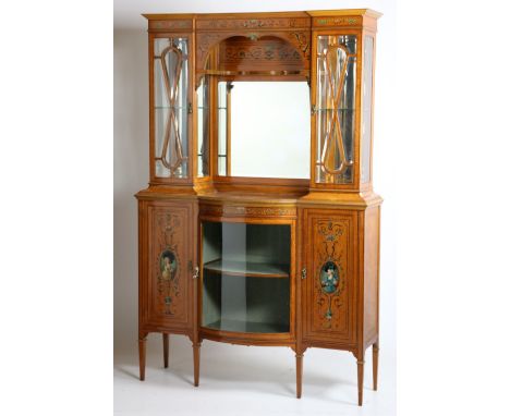 An extremely attractive Edwardian satinwood Cabinet, the upper section of inverted breakfront outline profusely decorated in 