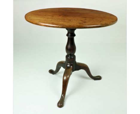 A George III flip top circular mahogany Tea Table, on turned stem and tripod base, 25" (74cms). (1)