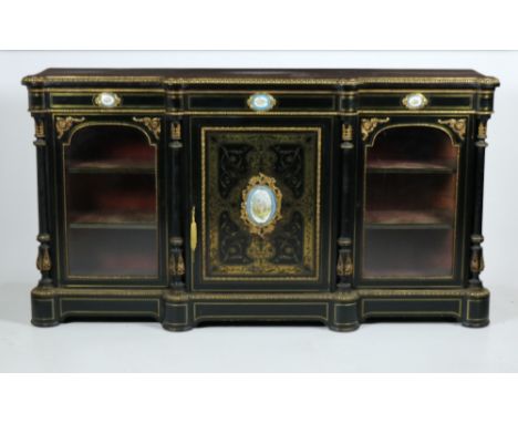 An exceptional 19th Century ebonised, brass mounted and brass inlaid Credenza, of breakfront outline, the frieze with three o