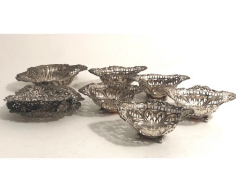 A collection of 8 varied engraved and pierced silver Bon Bon Dishes. (8)