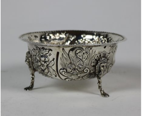 An Irish silver circular Sugar Bowl, Dublin 1899, retailed by Weir &amp; Sons, with punched beaded rim, the body embossed wit