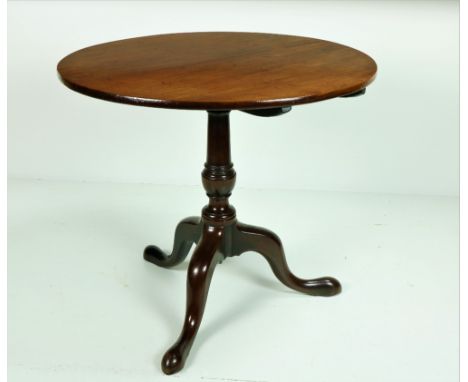 A 19th Century Irish mahogany circular flip top Table, on turned pillar support, terminating on tripod base with pad feet, ap