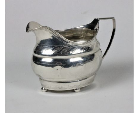 A Provincial bright cut silver Cream Jug, with reeded rim and attractive design, stamped S.G. (Samuel Green) Cork c. 1815, on