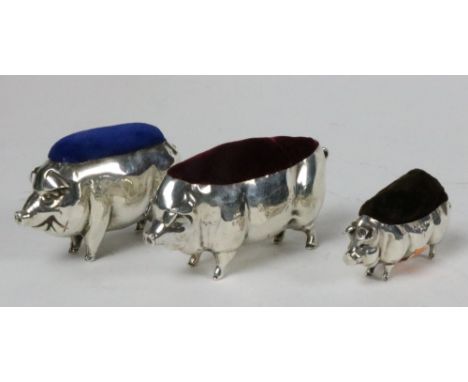 Three graduating English silver Novelty Pig Pincushions, two by Levy &amp; Salaman, Birmingham, c. 1904 - 1919, the largest c