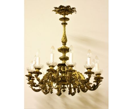 A fine quality early 19th Century Continental ormolu 12 branch Ceiling Light, with ornate rose, turned pillar, scroll arms an