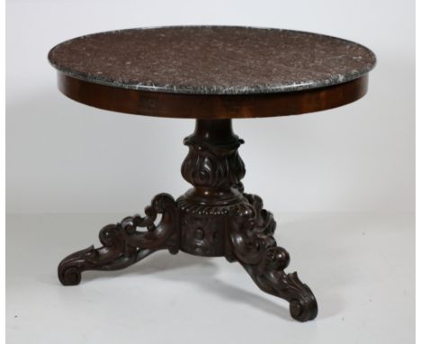 A late 19th Century French mahogany Centre Table, with grey circular veined marble top on ornate carved tripod base with scro