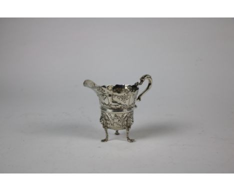 An Irish silver Cream Jug, Dublin 1894, with waived rim and acanthus leaf capped "S" scrolling handle, the body with central 