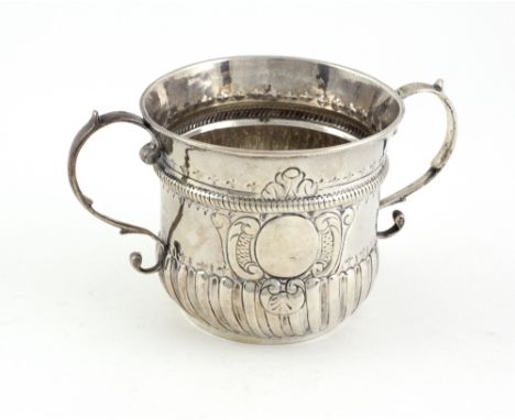 A good early George II English silver two handled Porringer, of plain fluted and half reeded form, with shaped scroll panel a