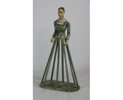 An attractive 41 1/2" Santos Cage Doll or Mannequin, with articulated arms, the face with pale painted complexion the body an