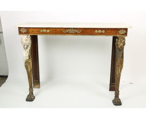 A Regency period Empire style marble top Console Table, with ormolu mounted decorative frieze and brass egg n' cart rim, on f