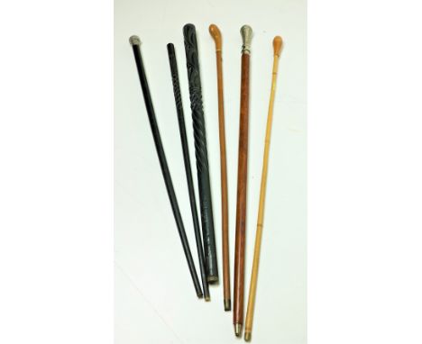 A collection of 6, varied Walking Sticks &amp; Canes, one silver mounted ebony cane, another large stick with decorated silve