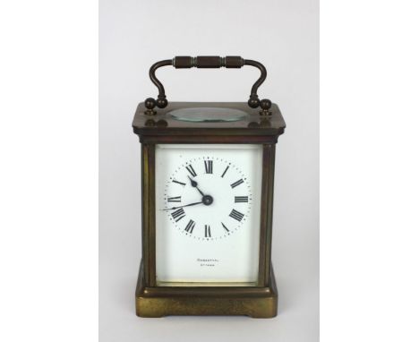 A small brass cased Carriage Clock, the white enamel dial with Roman numerals, and signed Rosenthal, Ottawa. (1)