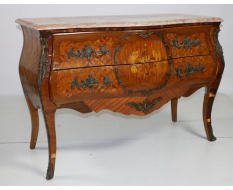 A 19th Century French Louis XV sytle marquetry bombé shaped Commode, with shaped sienna marble top, over two long drawers wit