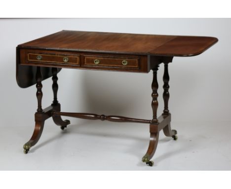 A Regency period brass inlaid mahogany Sofa Table, with rosewood crossbanding top above two mock and two frieze drawers flank