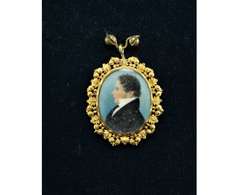 Early 19th Century English SchoolMiniature oval "Profile Portrait of a Gentleman with curling hair," on ivory, in ornate gilt