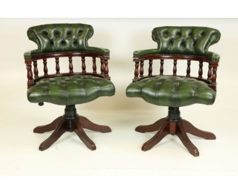 A set of three "Captain Swivel" deep button leather Boardroom or Office Chairs, by Winchester Furniture Company, the horse sh