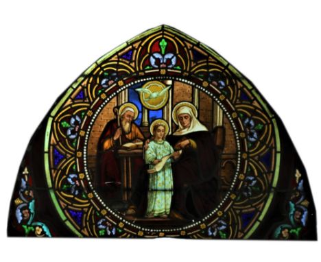 An arched Gothic style stained and leaded glass Panel, of arch form, the cartouche roundel with a Religious Group, 30" x 43" 