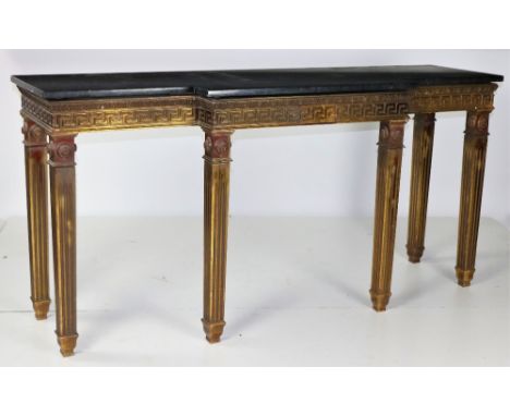 An attractive pair of "Empire" style marble top breakfront Console Tables, the black speckled marble tops over a frieze with 