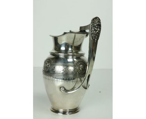A fine quality 19th Century American silver Jug, by Jabez Gorham, the Greek key pattern rim over a bulbous body attractively 