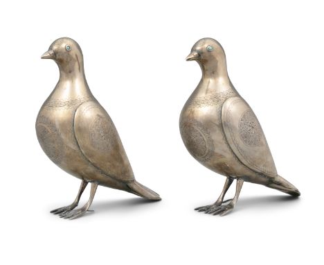A PAIR OF TURQUOISE EMBELLISHED SILVER BIRDS AND MAYBE DOVES IRAN (PERSIA), CIRCA 1900-1930 H: 19 cm Total weight: 690 grams 
